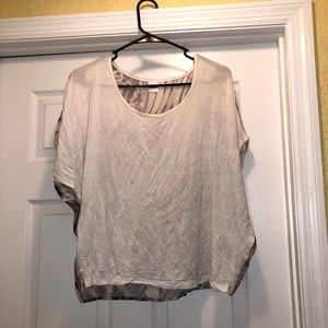 White shirt with colorful decorative back.